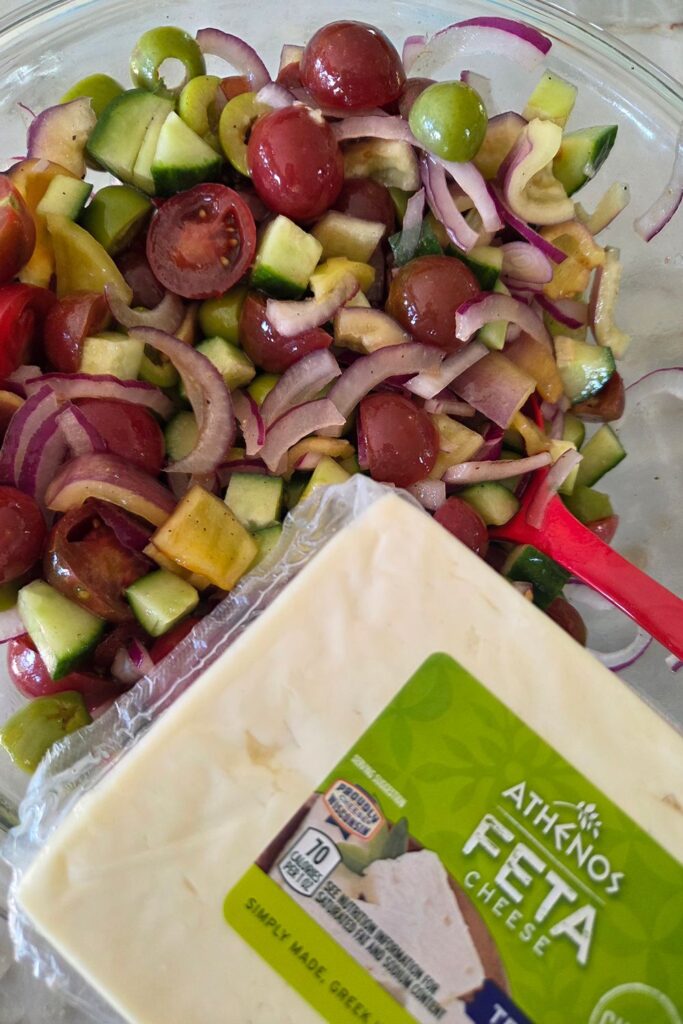 Greek Salad with red wine vinaigrette, Feta Cheese cubes additional option.